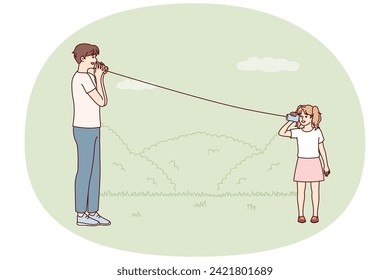 Little girl plays with father in park using cups tied with rope to talk from distance. Man rests with daughter during walk teaches how to use homemade phone from two mugs. Flat vector illustration