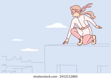 Little girl plays superhero sitting on roof and dreams of saving city residents from attackers. Child with superhero patch over eyes rejoices at opportunity to help people in trouble
