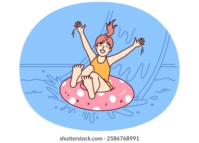 Little girl in pool floats on inflatable ring and enjoys visiting aqua park in sunny summer weather. Happy childhood of child relaxing in pool and sliding down slide in water park for kids