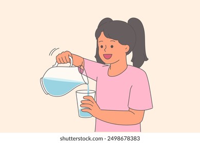 Little girl pours water into glass from decanter to quench thirst after summer walk. Happy child rejoices at opportunity to drink clean, refreshing water with tonic and detox effect