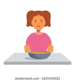 Little girl refusing to eat soup with disgust on her face, sitting at the table