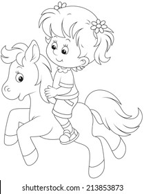 Little girl riding a pony