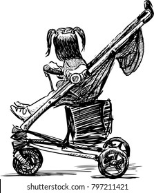 A little girl sitting in a baby carriage