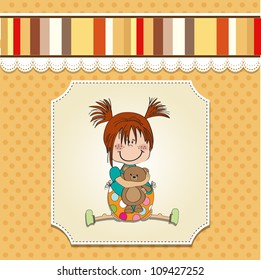 little girl sitting with her teddy bear