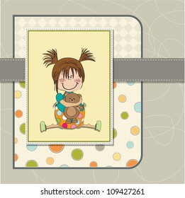 little girl sitting with her teddy bear