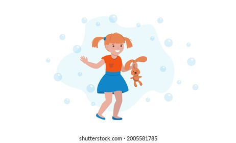A little girl smiles, waves her hand , holds a toy bunny with her other hand, and goes, soap bubbles fly around her .