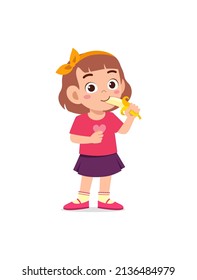 little girl standing and eating fresh banana