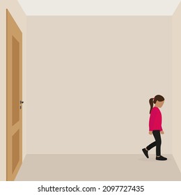 Little girl stands in the corner of the room with the door closed