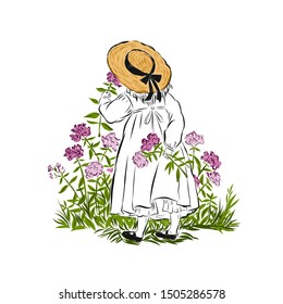 Little girl in straw hat sniffs flowers standing back and holding one torn flower in hand. Summertime garden. 