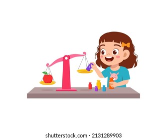 little girl study about weighing scale to balance object