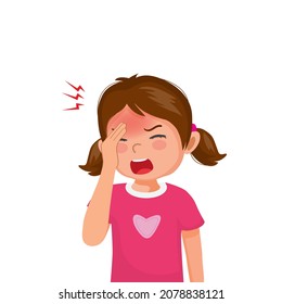 Little girl suffering from headache or migraine touching her forehead.