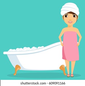 Little girl taking a bath. Filled with bubble bath. Hygiene and health. Girl with towel on her head.