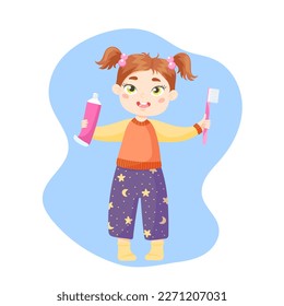 A little girl with two tails in pajamas holds a pink toothpaste and toothbrush in her hands