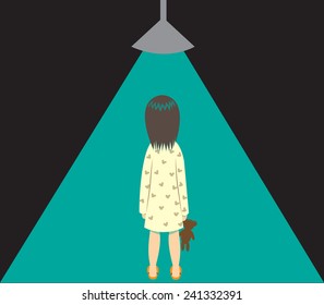 A little girl is under a beam of green light