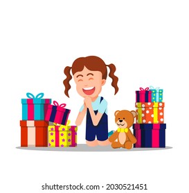 little girl is very happy because she gets a lot of gifts