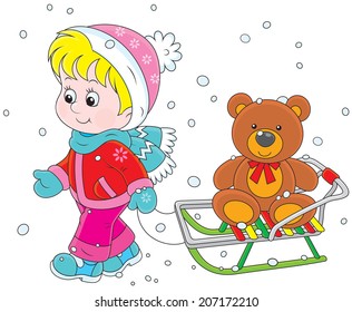 Little girl walking with her sledge and toy bear