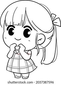 Little girl wearing a dress and holding a little heart.