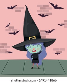 little girl with witch costume in the wall with bats flying