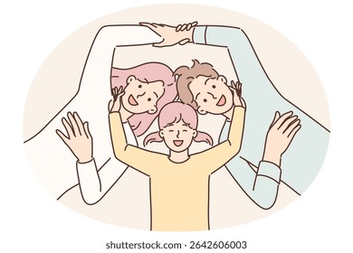 Little girl and young parents smiling lying together for happy family vacation concept, top view. Positive mom and dad near daughter holding hands and having fun enjoying family holiday