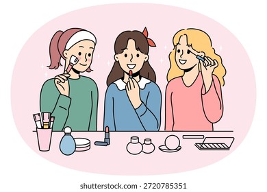 Las niñas pequeñas se maquillan con lápiz labial y rímel o polvo para prepararse para la fiesta escolar. Las colegialas quieren ser como madres y maquillarse, preparándose para salir con chicos de compañeros de clase.