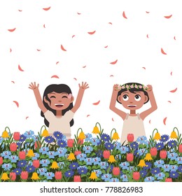 Little girls happily playing in flower field