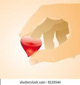 a little glass heart between two fingers, a care concept