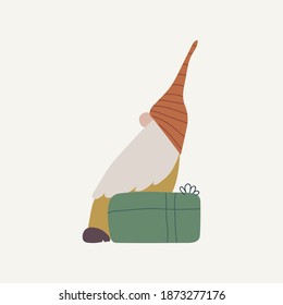 Little gnome sitting on gift box.  Christmas concept. Hand drawn vector illustration on white background. 