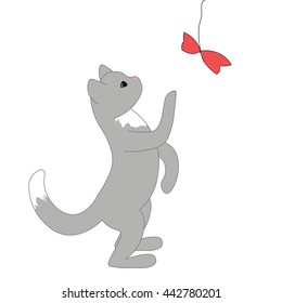 The little grey kitten standing on its hind legs. Cartoon cat looking for a toy. 