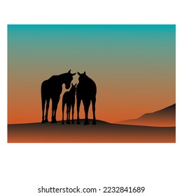 A little horse with his parents around him in the desert at sunset

