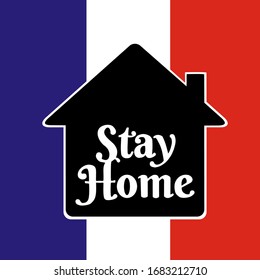 There’s a little house with a word Stay Home inside. It’s a sign following the COVID-19 campaign, stay at home campaign. Protective yourself and other by stay at home. The background is France flag.