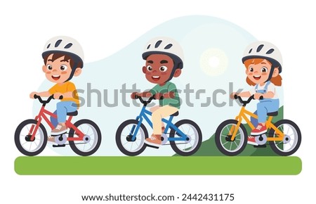 little kid boy and girl ride a bicycle in the park.