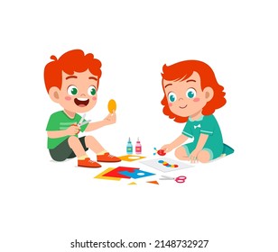 little kid cut paper for art with friend