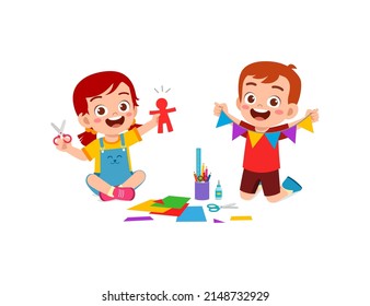 little kid cut paper for art with friend