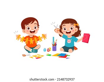 little kid cut paper for art with friend