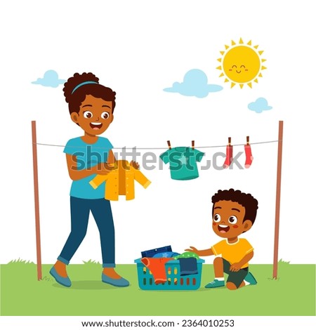 little kid help mom to hanging and dry clothes