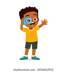 little kid holding camera and take photo