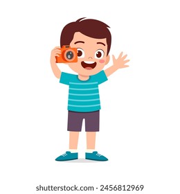little kid holding camera and take photo