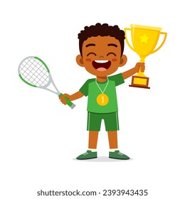 little kid holding trophy winning in sport