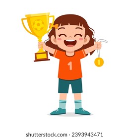 little kid holding trophy winning in sport