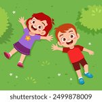 little kid lay down on park and feel happy