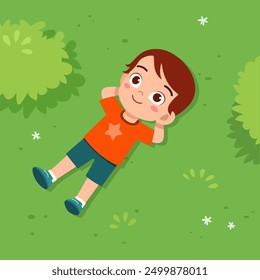 little kid lay down on park and feel happy