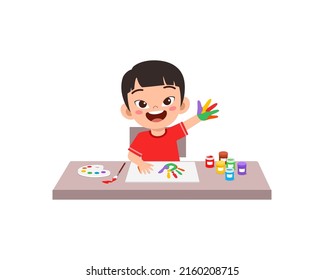 little kid make painting with hand stamp