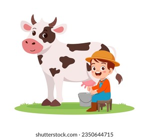 little kid milking cow and feel happy