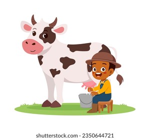 little kid milking cow and feel happy