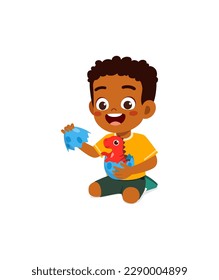 little kid play with dinosaur toy and feel happy