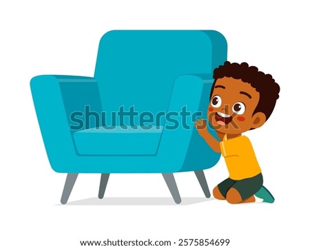 little kid play hide and seek and hiding behind chair