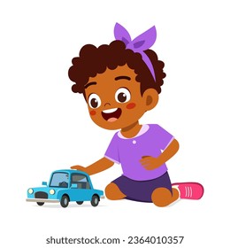 little kid play toy car model and feeling happy