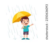 little kid playing in the rain and feel happy