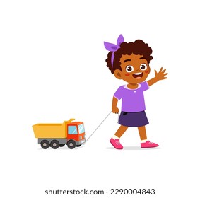 little kid playing a toy truck and feel happy