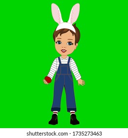 little kid with rabbit ears on her head, stands and holds Easter colored egg her hand, emoji on green isolated background